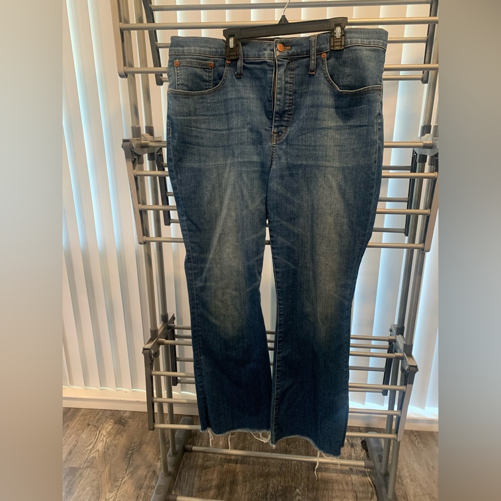 Madewell cali demi boot cut jean.  Raw hem with back stitching detail.